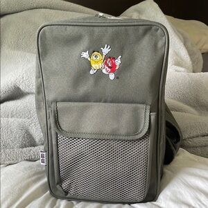 M&M'S | Official Merchandise | Army Green| Crossbody |Sling Backpack|Embroidered
